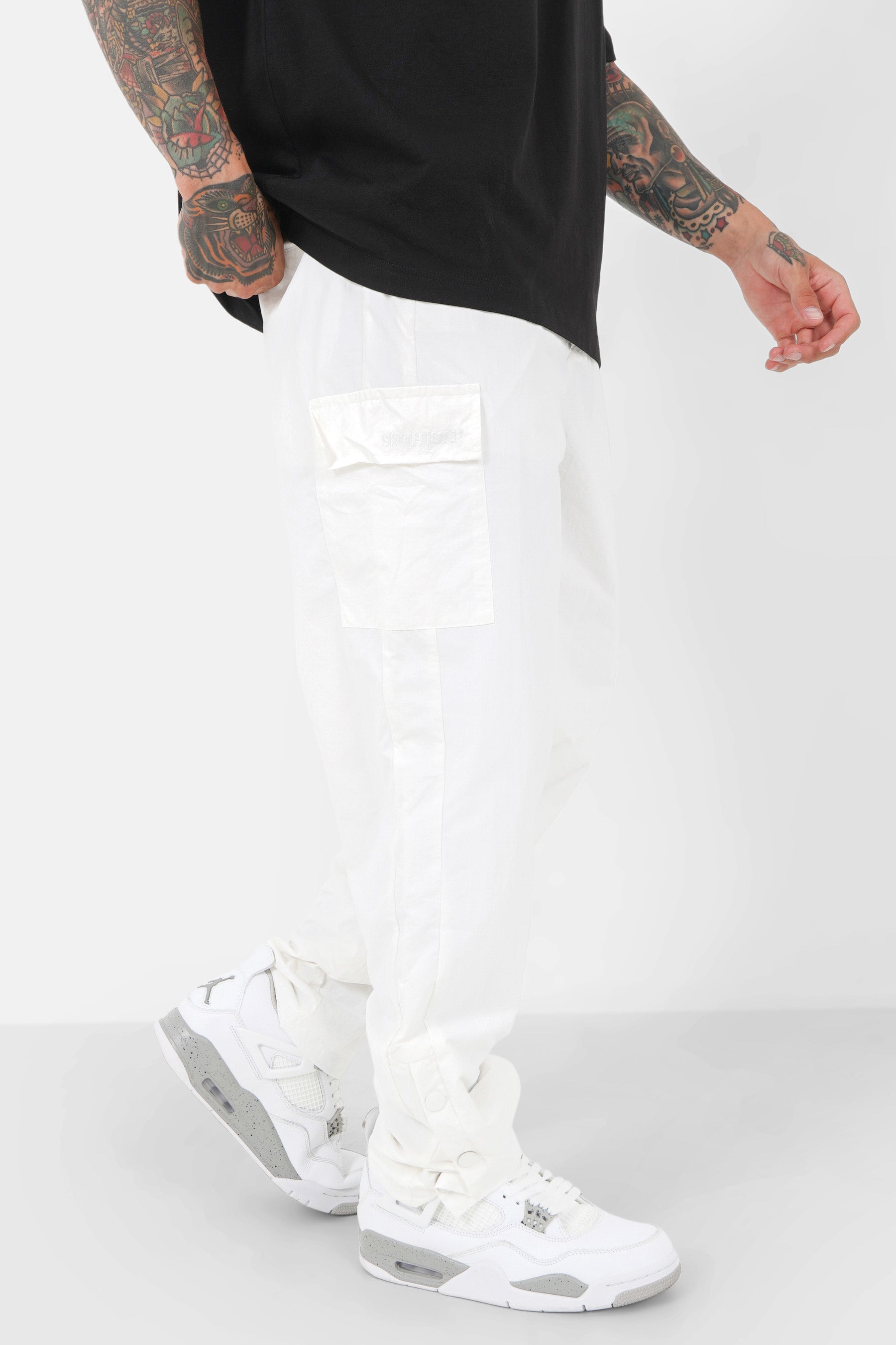 Buttons opening nylon pants White