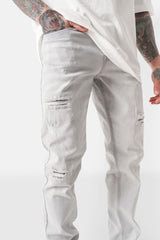 Slim-Jeans mit Used-Effekt-Patch Hellgrau