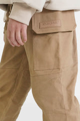 Beigefarbene Junior-Hose mit Kordelzug und Cargotaschen