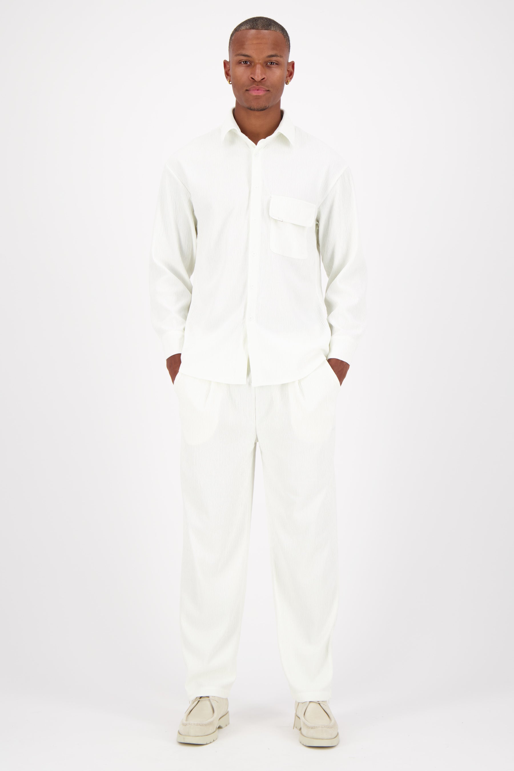 Shiny fluid textured pants White