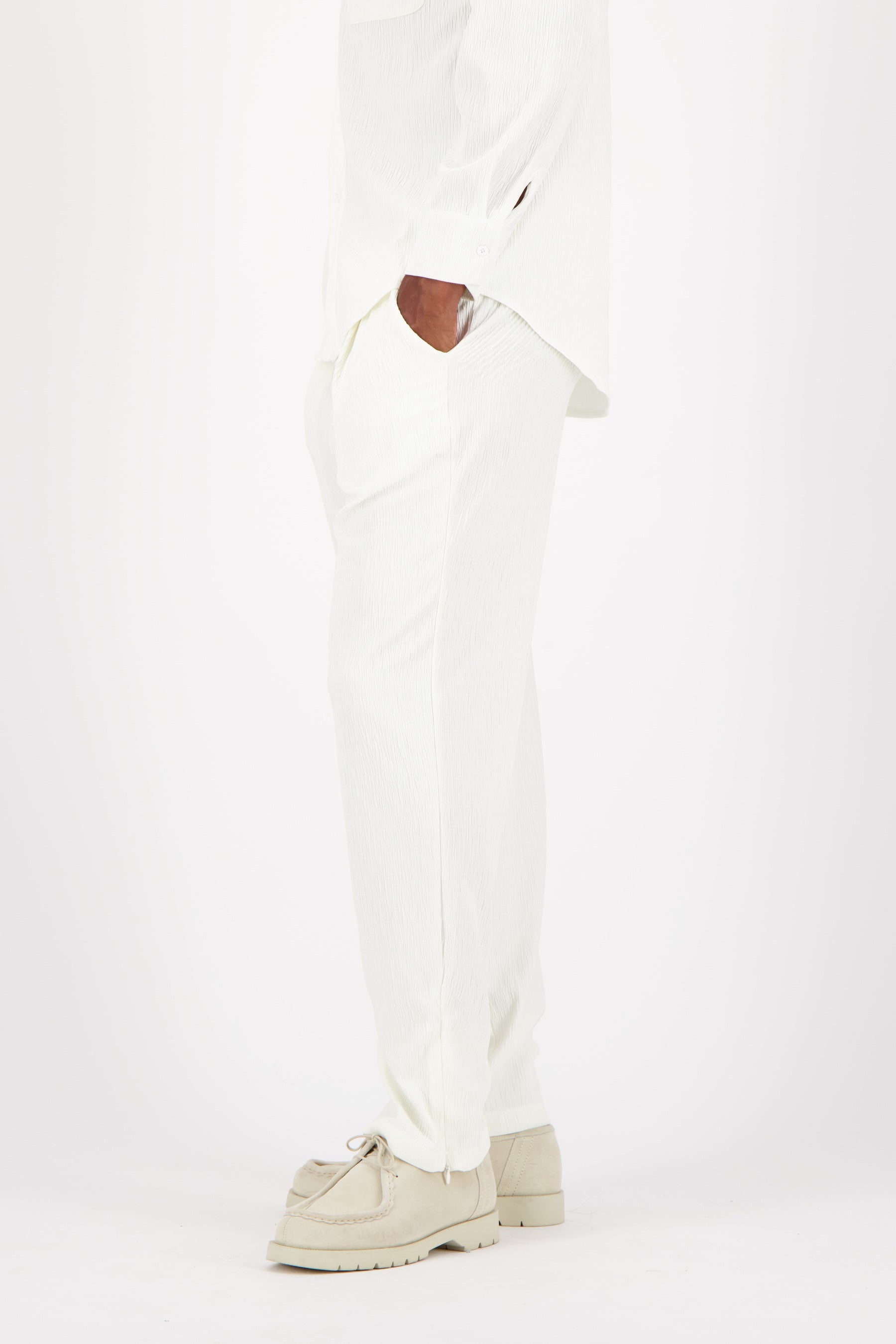 Shiny fluid textured pants White