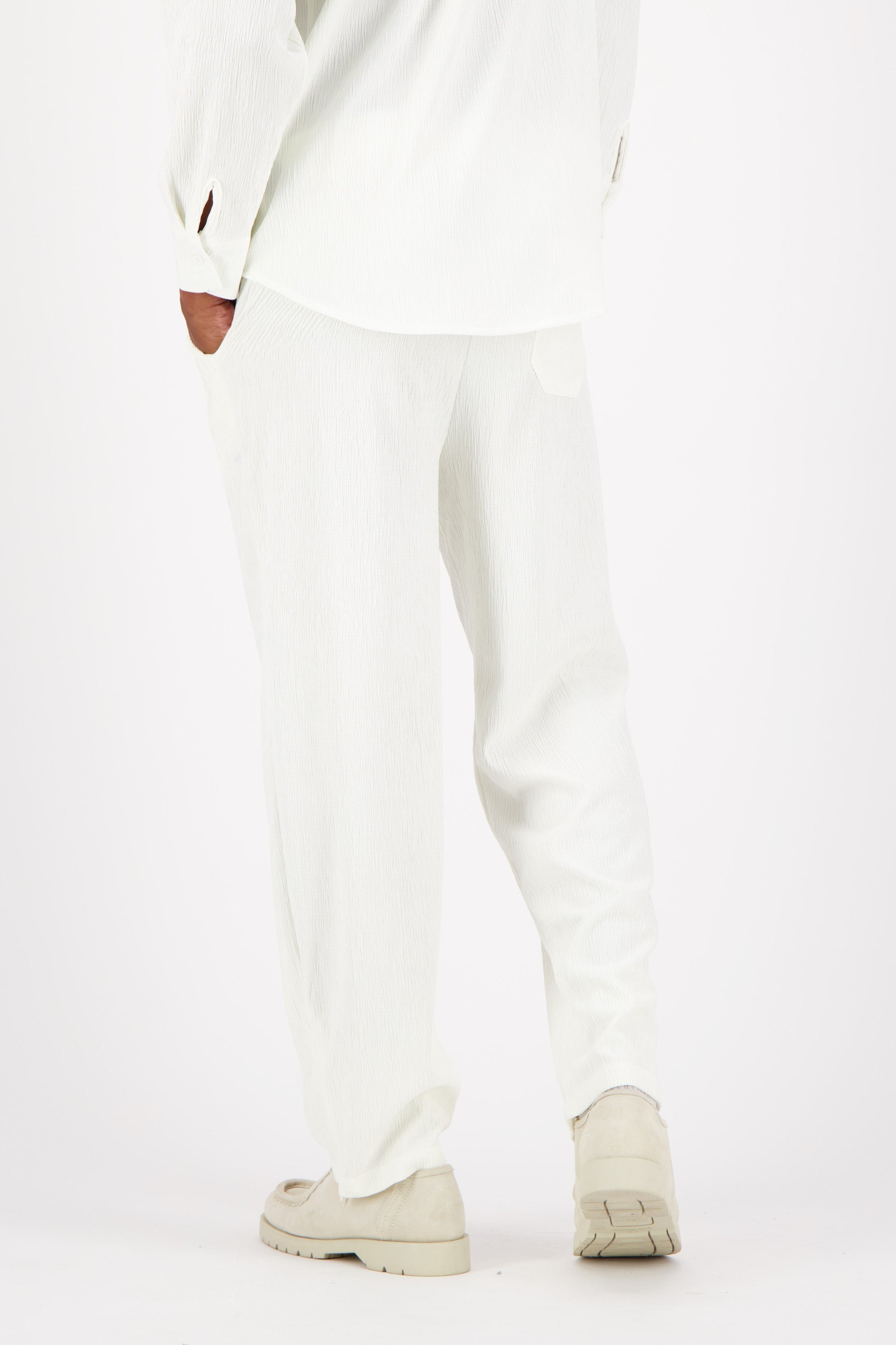 Shiny fluid textured pants White