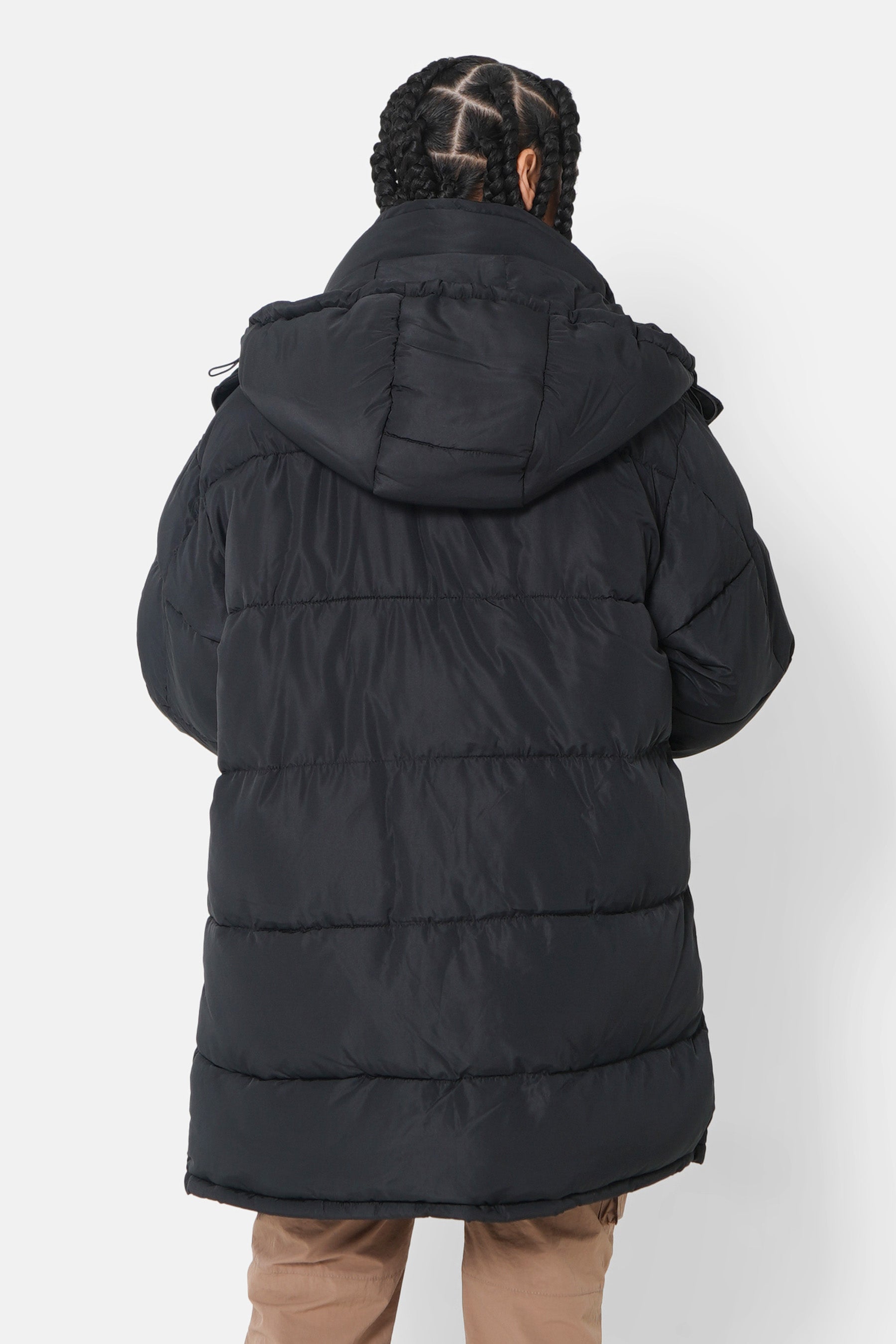 Lange, übergroße Daunenjacke in Schwarz