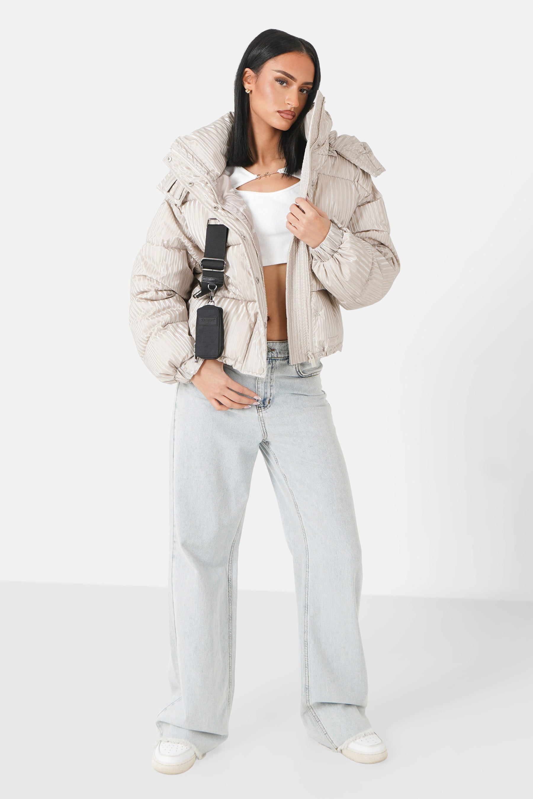Iridescent down jacket + Beige bag