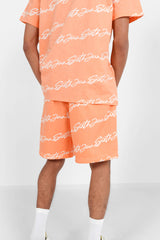 Shorts mit charakteristischem Logo-Print in Orange