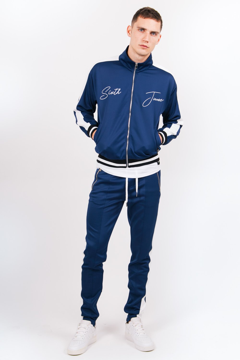 Jogging bicolores zips bleu blanc