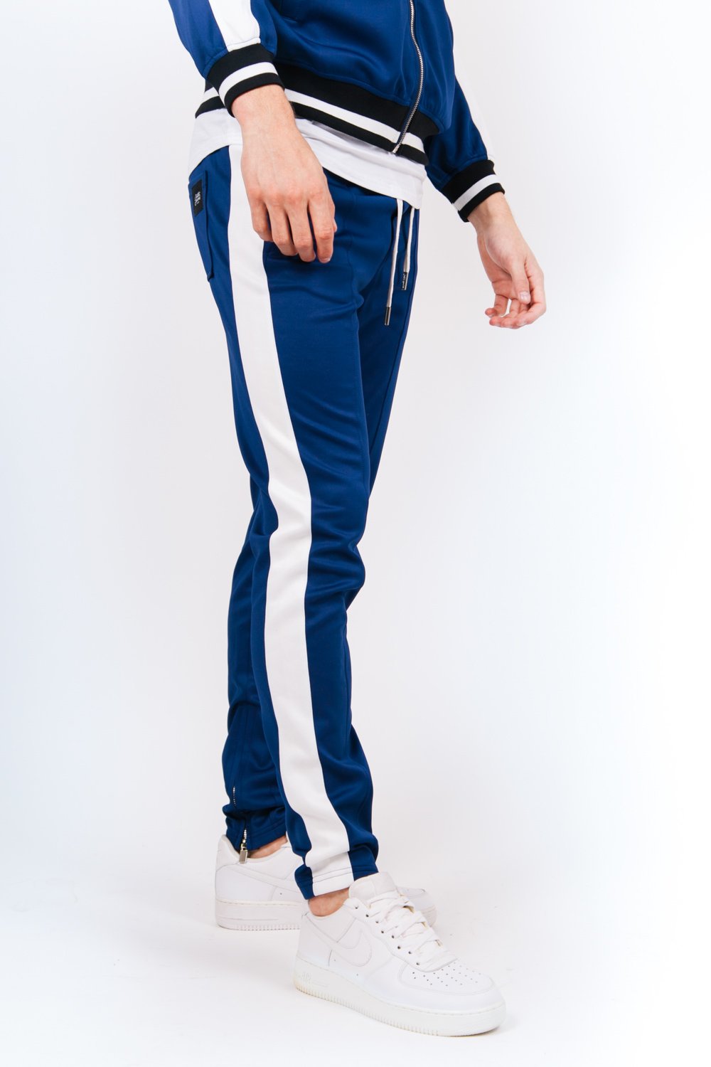 Jogging bicolores zips bleu blanc