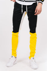 Dreifarbige Jogginghose, gelb, schwarz, weiße Schnallen