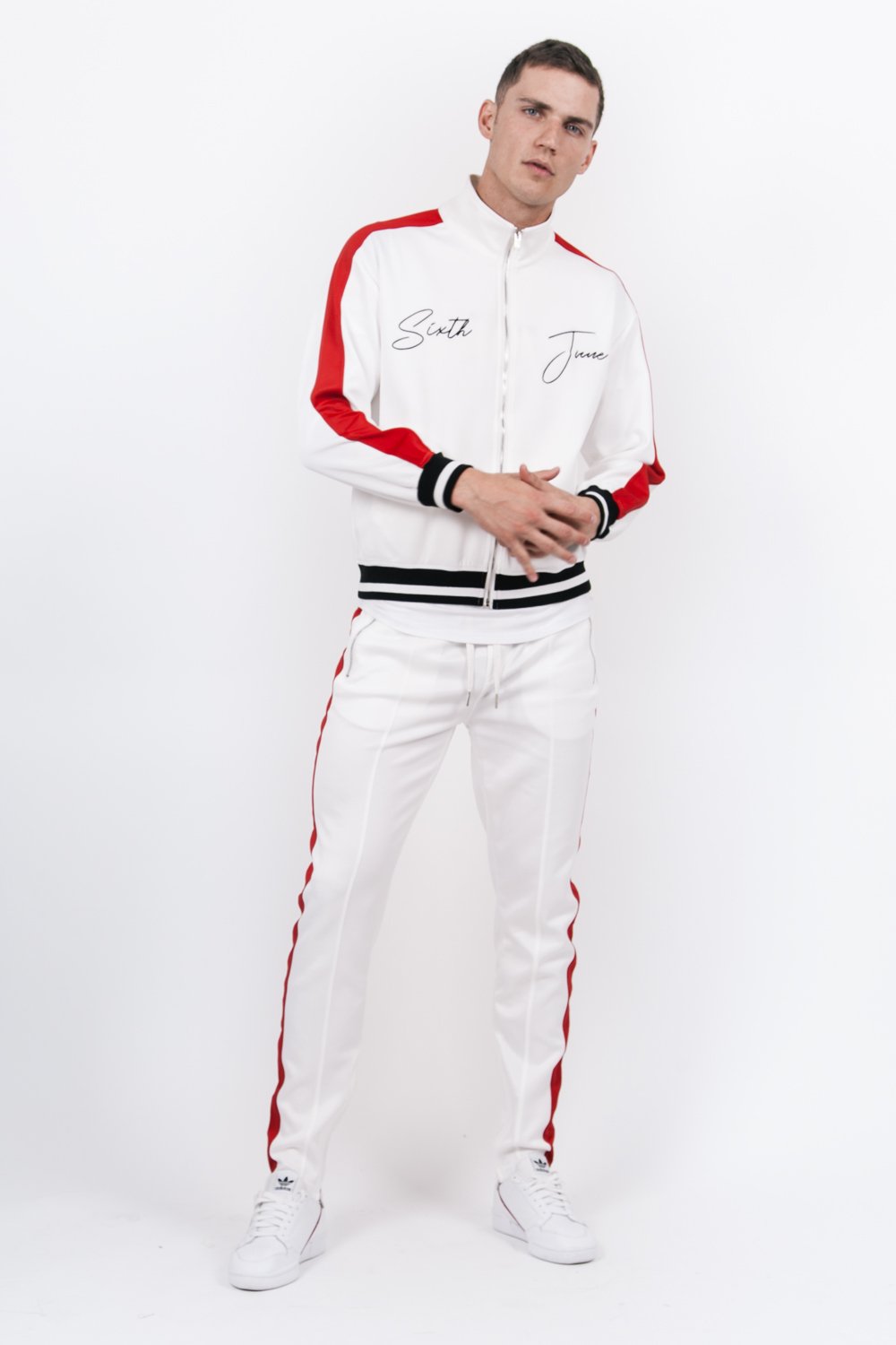 Jogging bicolores zips blanc rouge