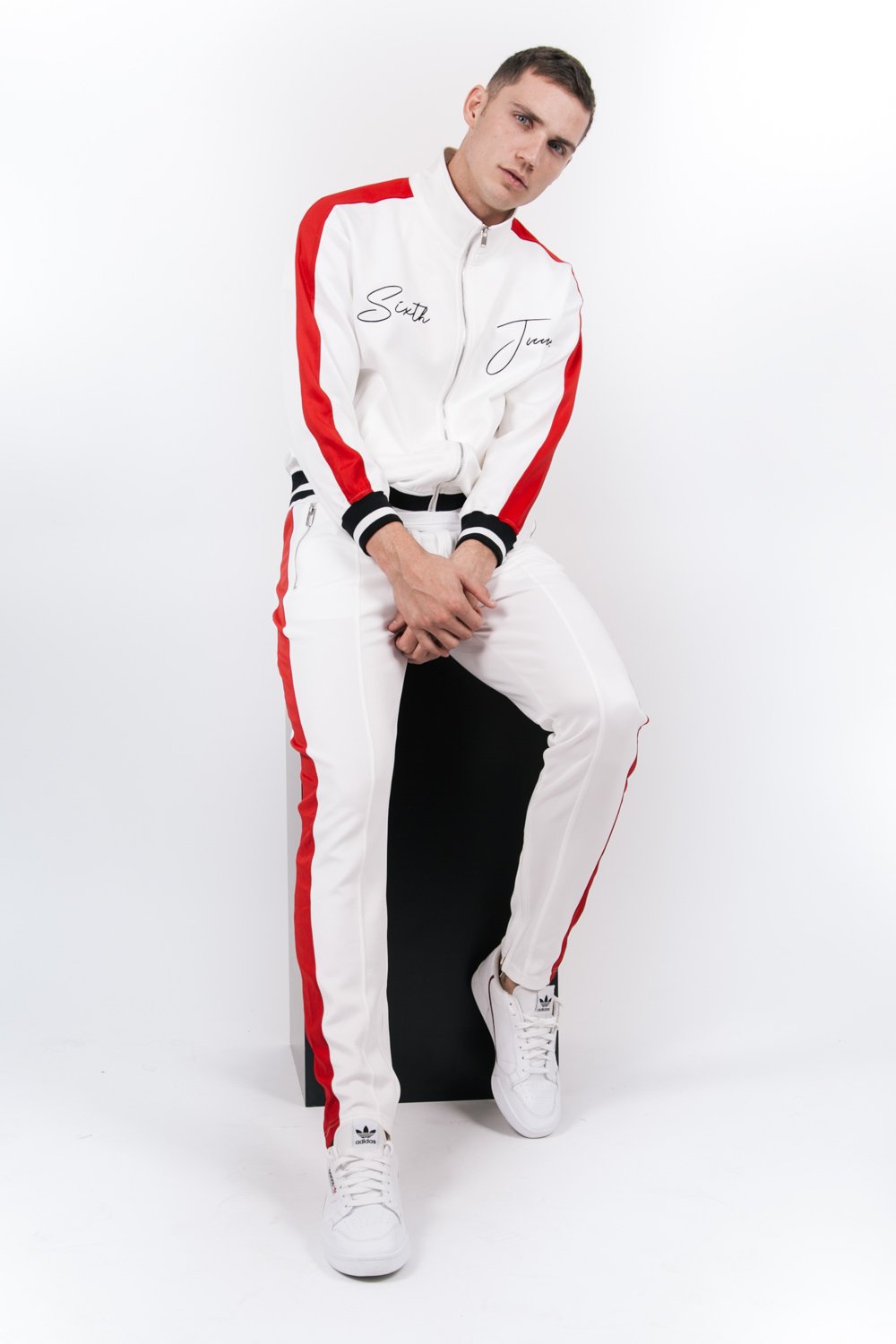 Jogging bicolores zips blanc rouge