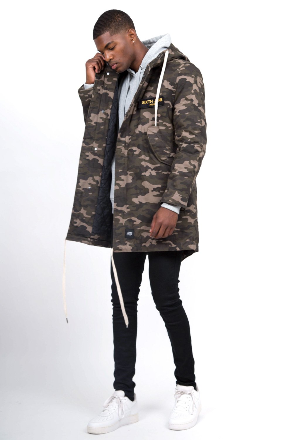 Camouflage-Parka mit grünen Aufnähern