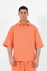 Orangefarbenes, übergroßes Waffel-Poloshirt